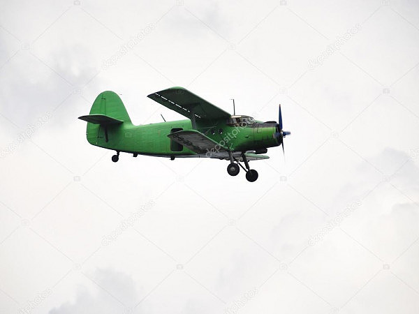 depositphotos_50349521-stock-photo-small-green-airplane-flying-in.jpg,0