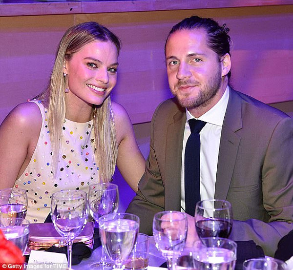 Gossip: Margot Robbie (left) could be getting ready for motherhood, if claims in an Australian magazine are to be believed. Pictured with husband Tom Ackerley in April 2017