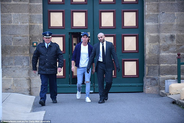 The 32-year-old was escorted by two guards as he walked out of Cooma prison (pictured)