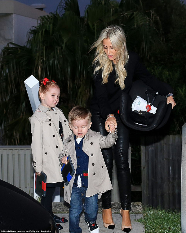  PR maven Roxy Jacenko has been seen leaving her east Sydney home with her two children in tow to meet her husband, disgraced banker Oliver Curtis, as he is released from jail (pictured)