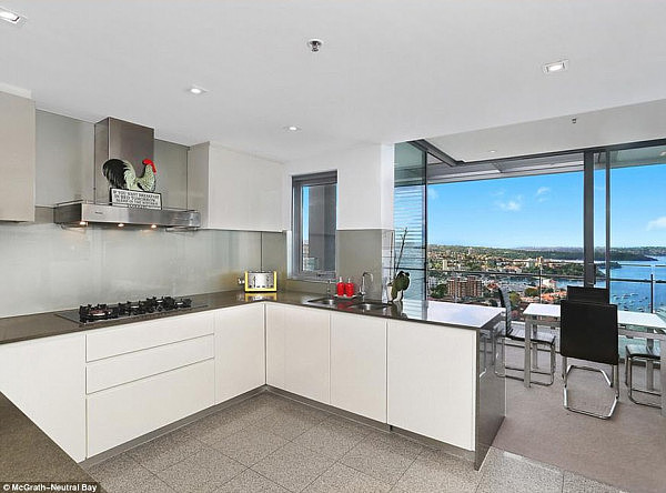 The gourmet kitchen with new appliances effortlessly flows to the outside balcony