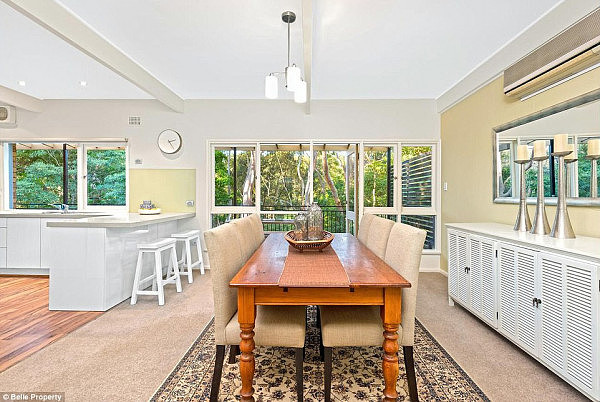 The young couple who bought the home (pictured) paid $200,000 over the reserve price in an auction attended by 40 people