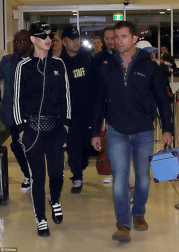 Live performance? As  fans watched Katy Perry perform 'live' on The Voice Australia on Sunday night, she was in a tracksuit getting ready to catch a flight at Sydney Airport