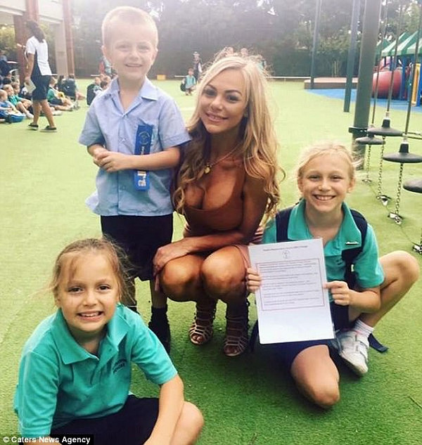 Bella Vrondos, 33, said she received hate online after she posted this photo of herself wearing a tight beige-coloured dress with her three children at their school