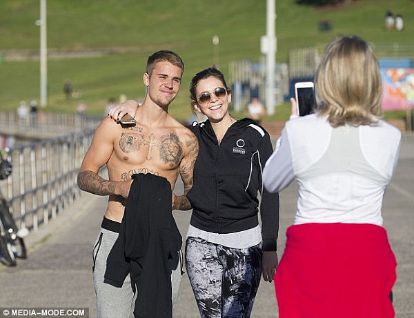 Fan friendly: Justin stopped to pose for photos with fans and appeared to be in good spirits
