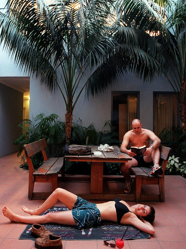 JULY 26, 2000 : Tourists Alan Sharp & Sarah Sutherill relax at Sydney Beachouse YHA in Collaroy, 26/07/00 after the backpackers hostel was awarded best budget accommodation in the State by NSW Awards for Excellence in Tourism. Pic;Troy Bendeich. Travel