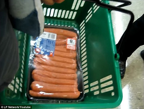 The camera man told the attempted sausage thief to re-enter the store otherwise he would be charged for stealing the 1.8kg of snags (pictured)