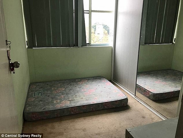 One bedroom looks barely big enough to fit a bed frame, while the second bedroom shows just a mattress lying on the floor