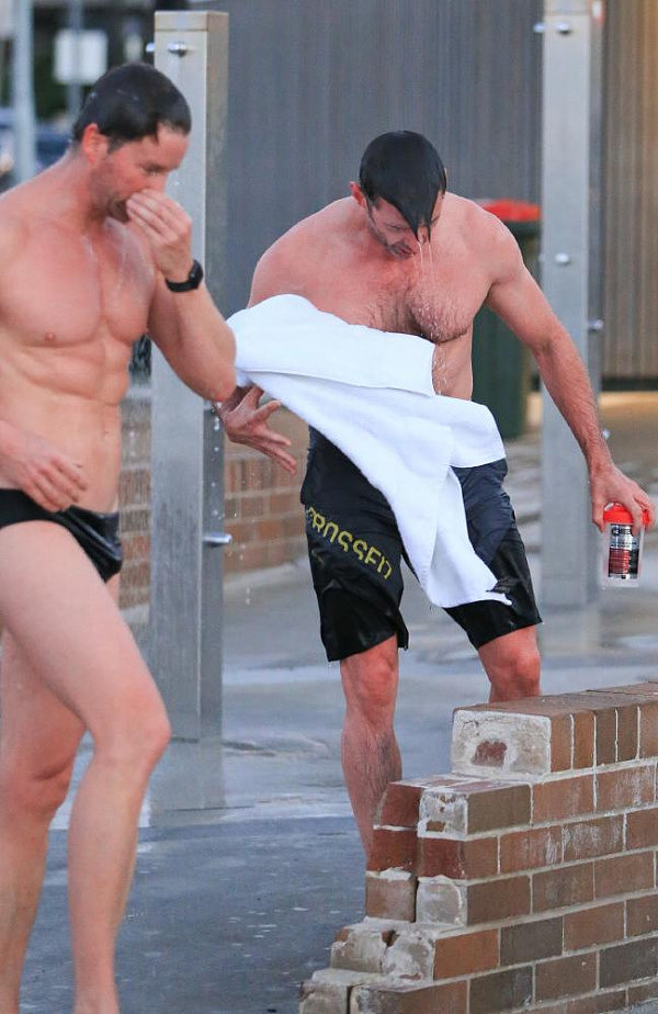 Think Hugh’s fit? Check out his personal trainer there in the speedos. Picture: Matrix Media