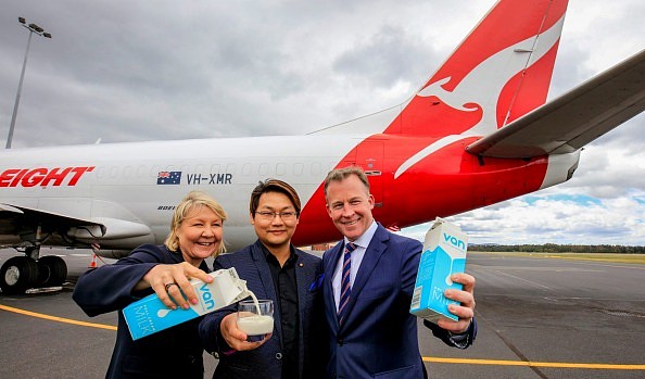 Qantas representative Alison Webster (left), Sean Shwe, managing director of Moon Lake Investments (centre), and ...