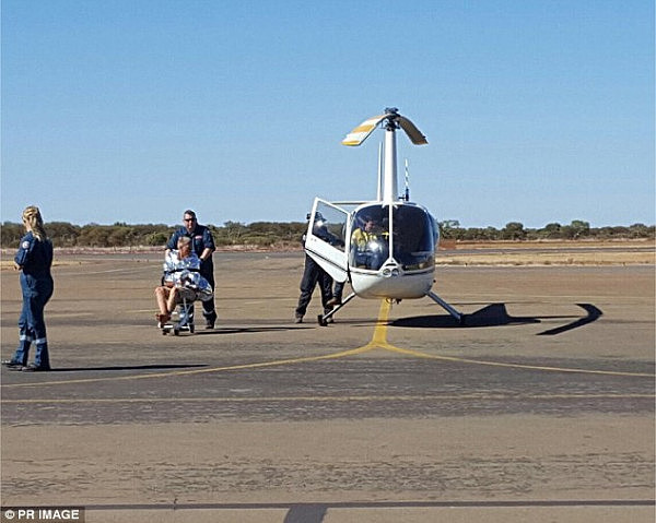 Mr Collis was found about a kilometre north of Lake Disappointment and was taken by helicopter (pictured) to Newman Hospital for treatment