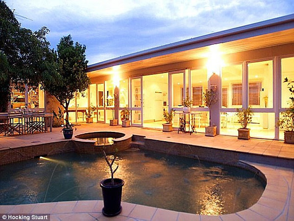 Real estate data reveals that the couple bought the home on Princess Street in Kew in 2004 for $680,000, although it is now worth at least $2.2 million (backyard with pool pictured)
