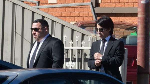 Michael Ibrahim, left, and his brother Fadi attend the funeral of Wally Ahmad in 2016.