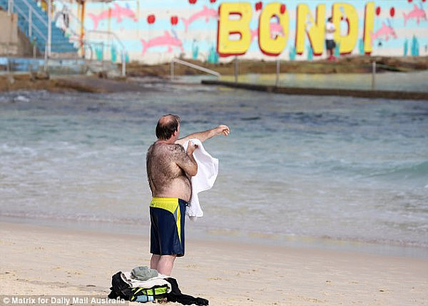 Sydney is set to swelter through the hottest September day in three years on Wednesday. Above, a man at Bondi Beach on Tuesday