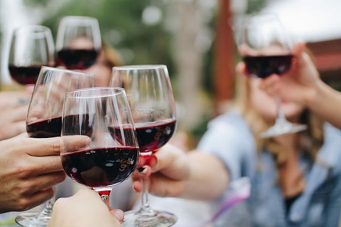 wine-red-glass-cheers.jpg