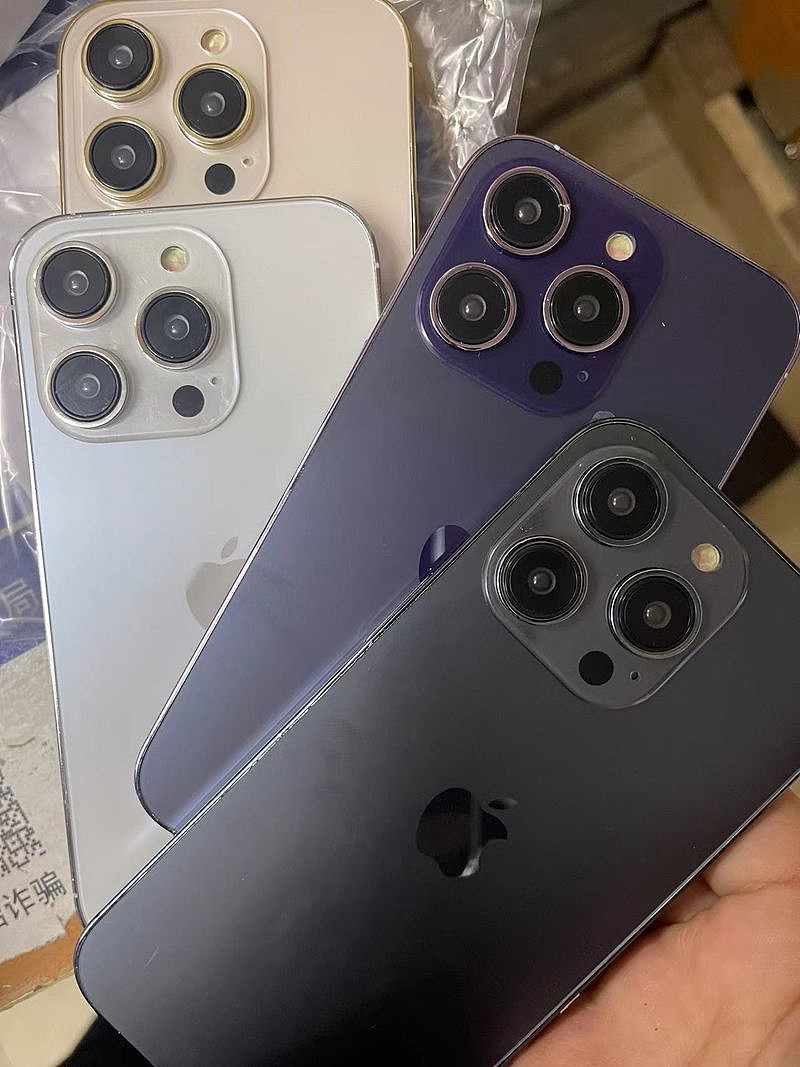 苹果 iPhone 14 Pro 机模展示，包含紫色和深蓝色版本 - 3